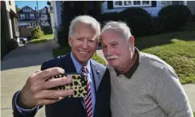  ??  ?? Joe Biden takes a selfie with Paul McGloin while visiting his childhood home in Scranton in October. Photograph: Jason Farmer/AP