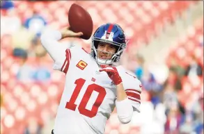  ?? Patrick Semansky / Associated Press ?? New York Giants quarterbac­k Eli Manning works out prior to a game against Washington in Landover, Md., in 2019.