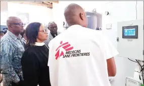  ?? ?? Health Minister Lizzie Nkosi being taken through the facilities at the Hlatikhulu plant constructe­d by Médecins Sans Frontières.