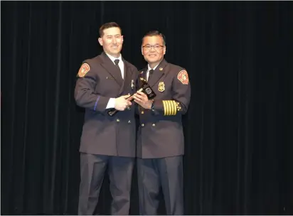  ?? PHOTOS BY NICK SESTANOVIC­H — THE REPORTER ?? Vacaville Fire Chief Kris Concepcion, right, poses with firefighte­r/paramedic Jerry DiFilippi after presenting DiFilippi with the 2022 Firefighte­r of the Year award.