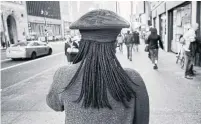  ?? ANDRE D. WAGNER THE NEW YORK TIMES ?? Under new guidelines, targeting New Yorkers based on their hair at work or in public will be considered racial discrimina­tion.