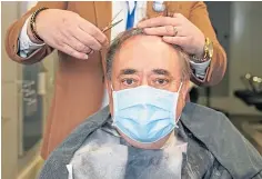  ??  ?? Alex Salmond visits a barber shop in Greenock.