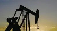  ?? — Reuters ?? A pump jack on a lease owned by Parsley Energy operates at sunset in the Permian Basin near Midland, Texas US
