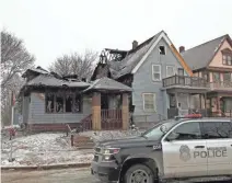  ?? ANGELA PETERSON / MILWAUKEE JOURNAL SENTINEL ?? Fire destroyed one house in the 3200 block of N. 21st St. and damaged another Thursday. It was one of several fires Milwaukee firefighte­rs battled on the cold day.