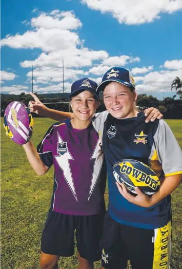  ?? Picture: STEWART McLEAN ?? EXCITING TIMES: Storm fan Vanessa Scarboroug­h and Cowboys fan Grace Kennedy, 12, will play in all-girls competitio­n next season.