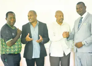  ?? PHOTO BY ALBERT FERGUSON ?? From left: Wendell Downswell, technical director, Jamaica Football Federation; Ian Myles, Godfrey Drummond’s campaign manager; Dave Scott, principal of Howard Cooke Primary School; and Godfrey Drummond, looking confident and ready to lead the teachers’ union.