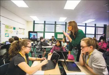  ?? Vincent D. Johnson TNS ?? MICHELLE REMMENGA teaches sixth-graders in Evergreen Park, Ill. Providers of 403(b) plans often send salespeopl­e to pitch high-priced investment products to unsuspecti­ng public-school teachers.