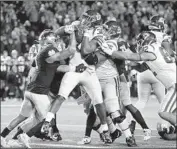  ?? Paul Sancya Associated Press ?? USC RUNNING BACK Markese Stepp (30) fights to get into the end zone against Notre Dame.