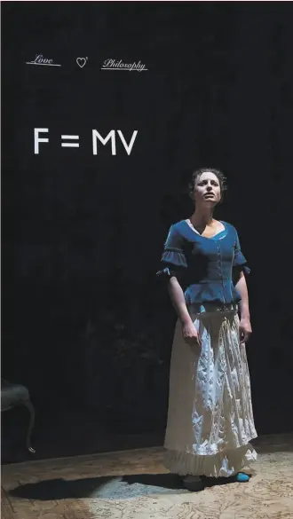  ?? Bob Grace ?? Emilie (Danielle Levin) works out a formula in Symmetry Theatre’s “Emilie: La Marquise du Châtelet Defends Her Life Tonight.”