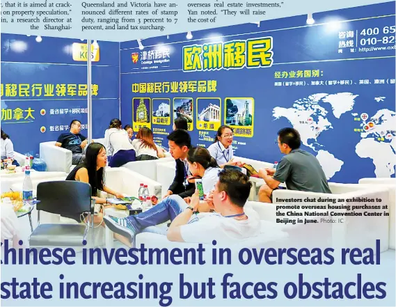  ??  ?? Investors chat during an exhibition to promote overseas housing purchases at the China National Convention Center in Beijing in June.