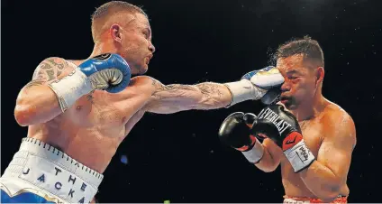  ?? Picture: REUTERS ?? THE HAMMER: Carl Frampton leads with a straight left to the face of Nonito Donaire
