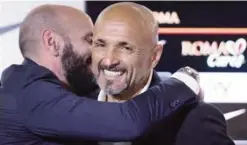  ??  ?? TRIGORIA: Outgoing Roma coach Luciano Spalletti, right, is hugged by Roma Sporting Director Ramon Rodriguez Verdejo during his last press conference at the Fulvio Bernardini Sports Center in Trigoria, Rome, yesterday.—AP