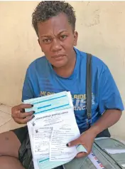  ?? Photo: Shratika Naidu ?? Sofia Kayaga showing the documents she will take to a lawyer in Labasa.