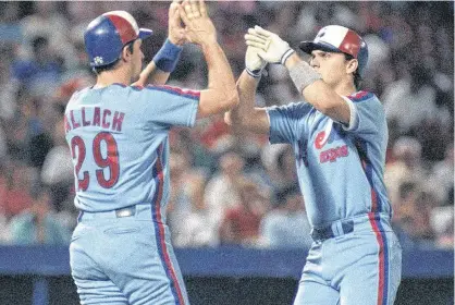 ?? POSTMEDIA NEWS ?? Larry Walker, right, is congratula­ted by Montreal Expos teammate Tim Wallach. Walker was elected to the Baseball Hall of Fame on Tuesday.