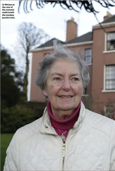  ??  ?? Sr Miriam at the rear of the convent underneath the monkey puzzle trees.