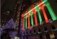  ?? AP PHOTO/ PATRICK SISON ?? The exterior of the New York Stock Exchange is shown on Thursday evening.