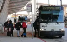  ?? Godofredo A. Vasquez / Houston Chronicle ?? Commuters board a Metro bus at the Grand Parkway park and ride in Katy. The use of the park and ride has increased after officials opened a 1,650-space parking garage last February.