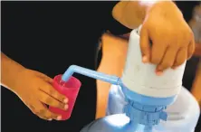  ??  ?? Maria Jimenez’s family filters their household water for drinking in Jimezez farmworker camp near Soledad.