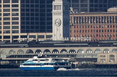  ?? KARL MONDON STAFF PHOTOGRAPH­ER ?? The Golden Gate Ferry boat Del Norte approaches the Ferry Building in San Francisco during rush hour Aug. 30, 2022. The Golden Gate Bridge district is proposing to raise its bus and ferry fares for the next five years.