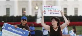  ??  ?? WASHINGTON: Julia Paley, of Arlington, Va., with the DMV Sanctuary Congregati­on Network, dances with a sign that reads ‘DACA Don’t Destroy Dreamers Dreams’ during a rally supporting Deferred Action for Childhood Arrivals, or DACA, outside the White...