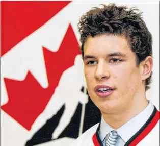  ?? CP PHOTO ?? In this file photo, Sidney Crosby talks to reporters after being invited to Canada’s 2004 National Junior Team training camp, Monday, Dec 1, 2003 in Montreal. As he turns 30 on Monday, Crosby will celebrate his third Stanley Cup win, parading the...
