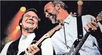  ?? COURTESY OF JEFF DAYTON ?? The late Glen Campbell (left) onstage with longtime bandleader Jeff Dayton.