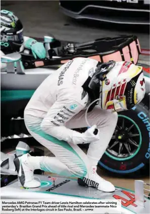 ?? AFPPIX ?? Mercedes AMG Petronas F1 Team driver Lewis Hamilton celebrates after winning yesterday’s Brazilian Grand Prix ahead of title rival and Mercedes teammate Nico Rosberg (left) at the Interlagos circuit in Sao Paulo, Brazil. –
