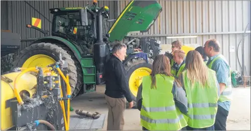  ?? Photo / Supplied ?? John shows TeenAg students around workshop.