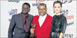  ?? AP PHOTO ?? Daniel Kaluuya, from left, Jordan Peele, and Allison Williams pose in the press room with the award for best feature for “Get Out” at the 33rd Film Independen­t Spirit Awards on Saturday, in Santa Monica, Calif.