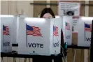  ??  ?? People vote in the Michigan primary election at Chrysler elementary school in Detroit, Michigan, on 10 March 2020. Photograph: Jeff Kowalsky/AFP via Getty Images