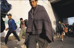  ?? Rodrigo Abd / Associated Press ?? Central Americans who are part of a caravan of immigrants leave Mexicali, Mexico, for the United States, where political asylum remains uncertain.