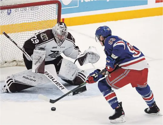  ?? CLIFFORD SKARSTEDT EXAMINER ?? Peterborou­gh Petes goalie Hunter Jones closes the door on the Kitchener Rangers' Jonathan Yantsis on Nov. 23 at the Memorial Centre.