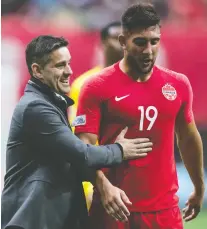  ?? THE CANADIAN PRESS/FILES ?? Canadian head coach John Herdman and Lucas Cavallini will face some stiff competitio­n during June’s Gold Cup.