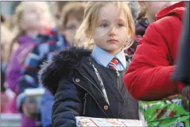  ??  ?? RIGHT: Erin O’Connor lining up to deliver her shoebox donation.