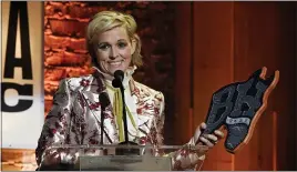  ?? ?? Brandi Carlile accepts the artist of the year award at the Americana Honors & Awards show Wednesday in Nashville, Tenn.