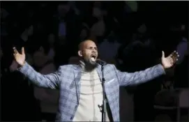  ?? FRANK FRANKLIN II — THE ASSOCIATED PRESS FILE ?? In this file photo, musical artist R. Kelly performs the national anthem before an NBA basketball game between the Brooklyn Nets and the Atlanta Hawks in New York.