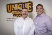  ?? COURTESY OF UNIQUE SACKS ?? Bill Spannuth, left, vice president and chief financial office of Unique Snacks, and Justin Spannuth, vice president and chief operating officer, promote the rebranded look for the nearly 100-year-old pretzel manufactur­er.