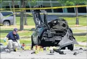  ?? Ben Torres Getty Images ?? FBI INVESTIGAT­ORS examine the scene of a terrorist shooting in Garland, Texas, in 2015.