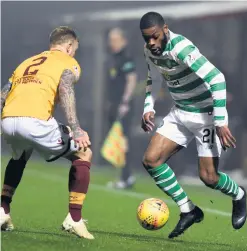  ??  ?? Duel: Olivier Ntcham takes on Motherwell’s Richard Tait