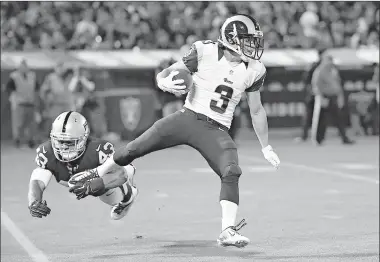  ?? Associated Press file photo ?? St. Louis Rams wide receiver Daniel Rodriguez (3) runs past Oakland Raiders linebacker Jimmy Hall (43) during the second half of an NFL preseason football game Aug. 14 in Oakland, Calif. Long after the rest of the St. Louis Rams have left the practice...