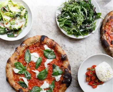  ??  ?? Top left: Pamela Yung, Flor head chef and ‘pizzaiola straordina­ria’. Top: Asap’s ‘Thanks Shallot’ pizza with grilled spring onions, mozzarella, ricotta, green garlic and wild marjoram. Above: the ‘Marg & Rita’ (tomato sauce, mozzarella, Spenwood cheese and basil) with side plates of burrata, tomatoes and dressed salads