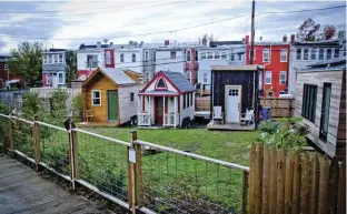  ??  ?? Elaine Walker’s tiny house (middle) has traveled the country and even made a layover in Washington, D.C. as part of a showcase on living small.