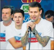  ?? GETTY IMAGES ?? Fyodor Smolov (front) with Russian teammates at a Fifa Fan Fest site on Moscow's Sparrow Hills on Sunday.
