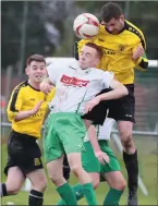  ??  ?? Cormac McGroggan, scorer of two Duleek goals, battles with Carrick’s Benny Skeane.