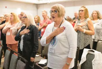  ?? REBECCA S. GRATZ/AP ?? Robbie Adams, of Sarpy County, Neb., recites the Pledge of Allegiance at Neb. Election Integrity Forum.