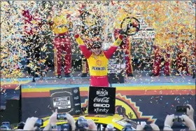  ?? RICK SCUTERI — THE ASSOCIATED PRESS ?? Joey Logano celebrates after winning a NASCAR Cup Series auto race and championsh­ip Sunday, Nov. 6, 2022, in Avondale, Ariz.