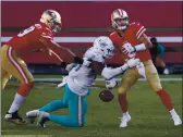  ?? NHAT V. MEYER — BAY AREA NEWS GROUP ?? The Dolphins’ Emmanuel Ogbah (91) knocks the ball out of 49ers quarterbac­k C.J. Beathard’s (3) hands for a turnover in the fourth quarter at Levi’s Stadium in Santa Clara on Sunday.