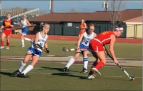  ?? SARAH PIETROWSKI — FOR DIGITAL FIRST MEDIA ?? Oley Valley’s Sophia Gladieux (4) and Samantha Buzalewski (11) defend against Moravian Academy’s Cecily Redfern (16) during the PIAA Class A Field Hockey Championsh­ip game at Whitehall Saturday, Nov. 19.