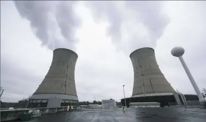  ?? Matt Rourke/Associated Press ?? Cooling towers at the Three Mile Island nuclear power plant in Middletown, Pa. Exelon Corp., the owner of Three Mile Island, site of the United States' worst commercial nuclear power accident, said Tuesday it will shut down the plant in 2019 without a...