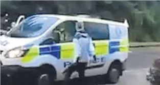  ??  ?? The thug swore at officers and banged on a van’s bonnet before they drove off.